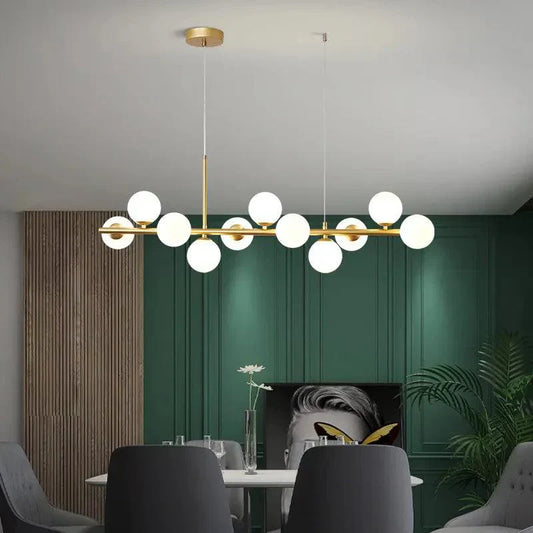 LumaSphere - Moderne lysekrone med lang pendel over bordet